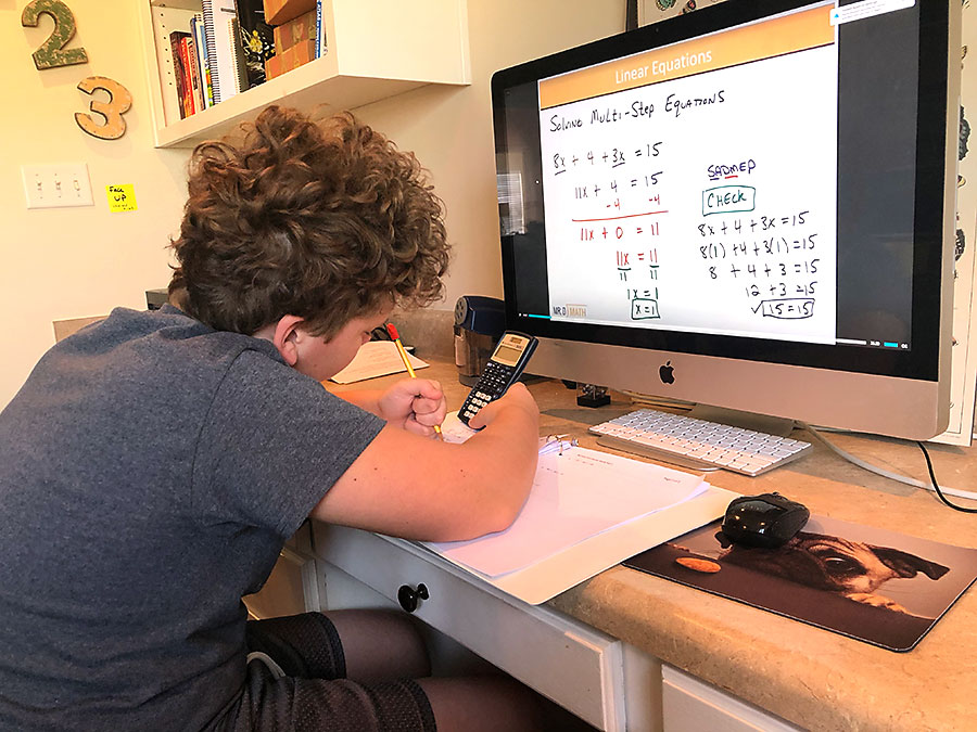 boy doing prealgebra on computer