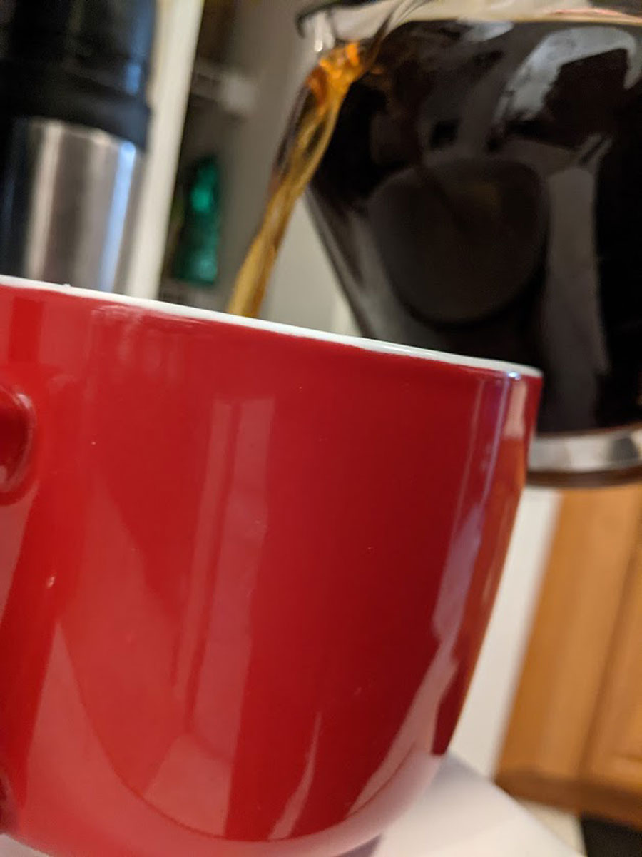 pouring coffee red cup