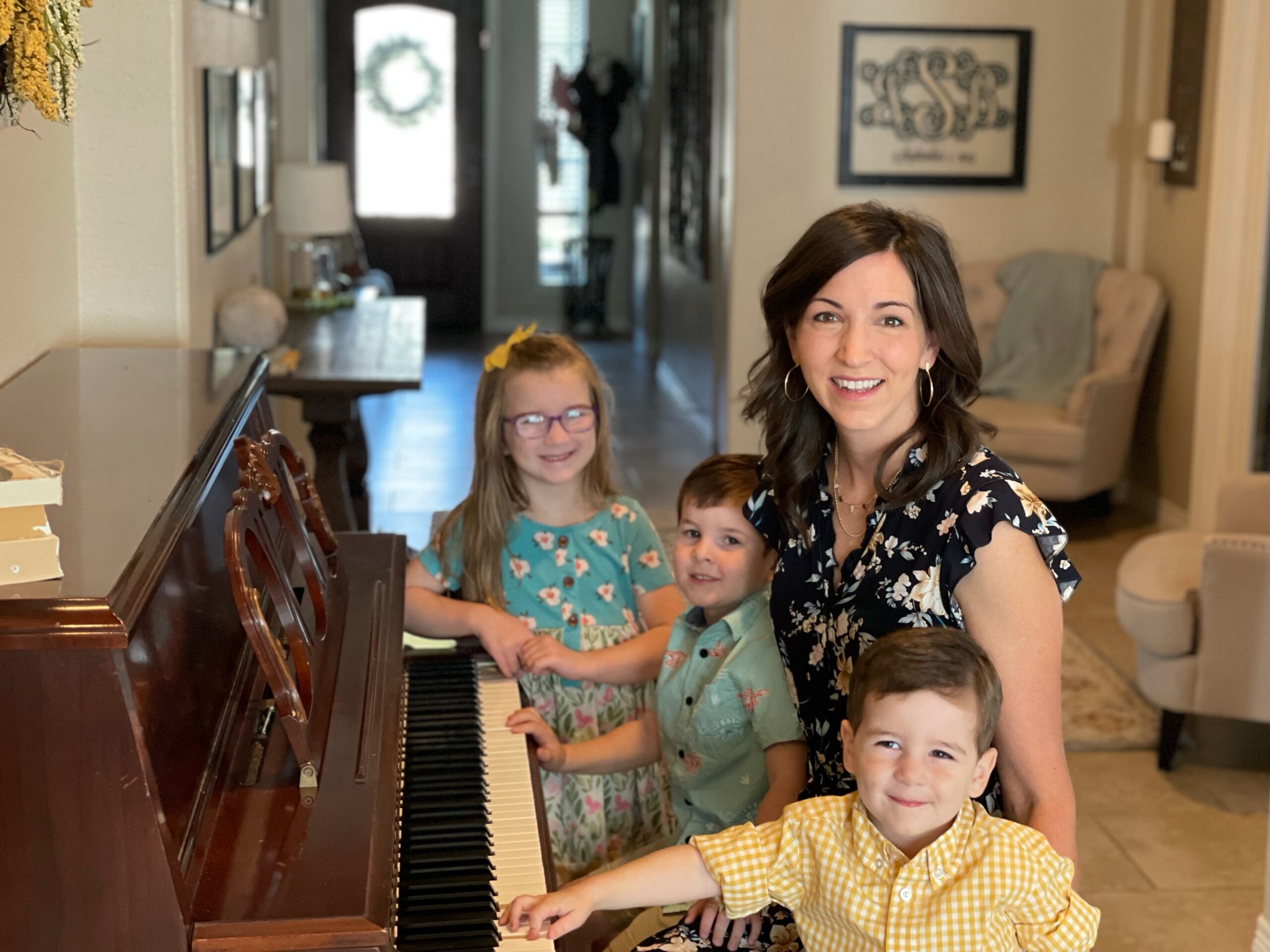 mom and children at piano